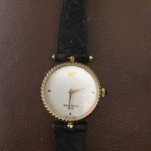 Nina Ricci gold plated watch. 15, 7 81 on back